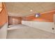 Unfinished basement area with exposed brick wall at 17009 E Loyola Pl, Aurora, CO 80013