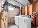 Unfinished basement laundry area with washer and dryer hookups at 17009 E Loyola Pl, Aurora, CO 80013