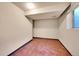 Basement room with tiled floor and a window at 17009 E Loyola Pl, Aurora, CO 80013