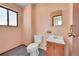 Simple bathroom with a toilet, sink, and shower at 17009 E Loyola Pl, Aurora, CO 80013