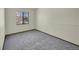 Bright bedroom with carpet flooring and a window offering natural light at 17009 E Loyola Pl, Aurora, CO 80013