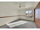 Spacious bedroom featuring a ceiling fan and ample natural light at 17009 E Loyola Pl, Aurora, CO 80013