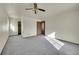 Well-lit bedroom with carpet flooring and a closet at 17009 E Loyola Pl, Aurora, CO 80013