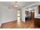 Dining room with hardwood floors, offering views into the kitchen at 17009 E Loyola Pl, Aurora, CO 80013