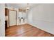 Simple dining area with hardwood floors and a chandelier at 17009 E Loyola Pl, Aurora, CO 80013