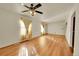 Bright living room featuring hardwood floors and a ceiling fan at 17009 E Loyola Pl, Aurora, CO 80013