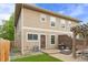 Backyard with artificial grass, patio, grill, modern firepit, and pergola with outdoor seating at 4511 Perry St, Denver, CO 80212