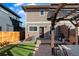 Cozy backyard patio with a pergola, seating and a grill for outdoor entertaining at 4511 Perry St, Denver, CO 80212