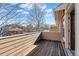 An empty balcony with wood floors and an open roof to look out at the neighborhood at 4511 Perry St, Denver, CO 80212