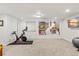 Basement with exercise equipment, TV, modern art and plenty of open space at 4511 Perry St, Denver, CO 80212