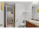 Bathroom with stylish vanity and granite countertop and access to stand up shower at 4511 Perry St, Denver, CO 80212