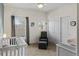 Neutral bedroom with a ceiling fan, closet, and two windows providing plenty of natural light at 4511 Perry St, Denver, CO 80212