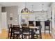 Dining area with modern pendant lighting and a bar with stools at 4511 Perry St, Denver, CO 80212