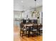 Bright dining area with stylish lighting, seating and hardwood floors at 4511 Perry St, Denver, CO 80212