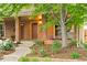 Inviting brick home with a covered front porch and neatly landscaped yard at 4511 Perry St, Denver, CO 80212