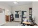 Well-lit home office space with desk, shelving and natural light from two windows at 4511 Perry St, Denver, CO 80212