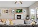 Comfortable living room with fireplace, hardwood floors, and large windows at 4511 Perry St, Denver, CO 80212
