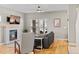 Cozy living room featuring a tiled fireplace, hardwood floors, and ample natural light at 4511 Perry St, Denver, CO 80212