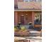 Charming front porch with brick accents and a well-maintained garden at 4511 Perry St, Denver, CO 80212