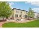 This home features a spacious backyard, patio, and green lawn ideal for outdoor activities and entertaining at 2605 Gray Wolf Loop, Broomfield, CO 80023