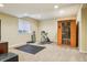 Finished basement area with recessed lighting, sauna, exercise bike and yoga mat at 2605 Gray Wolf Loop, Broomfield, CO 80023