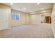 Spacious finished basement with neutral carpet, a sauna, and natural light from a window at 2605 Gray Wolf Loop, Broomfield, CO 80023