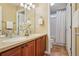 Bright bathroom features a double sink vanity with granite countertop and a separate shower and toilet area at 2605 Gray Wolf Loop, Broomfield, CO 80023