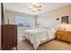 Comfortable bedroom with a large window, closet, and ample natural light at 2605 Gray Wolf Loop, Broomfield, CO 80023