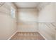 Walk-in closet featuring wire shelving and carpeted floors, ready for organization at 2605 Gray Wolf Loop, Broomfield, CO 80023