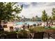 View of the community pool area with many chairs and umbrellas for residents to enjoy at 2605 Gray Wolf Loop, Broomfield, CO 80023