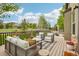 This home has a large wooden deck with comfortable seating, perfect for relaxing and enjoying the outdoor views at 2605 Gray Wolf Loop, Broomfield, CO 80023