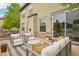 An outdoor seating area on the home's deck with stylish furniture and stone accents at 2605 Gray Wolf Loop, Broomfield, CO 80023