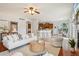 Living room features hardwood floors, a ceiling fan, and an archway that connects to the kitchen at 2605 Gray Wolf Loop, Broomfield, CO 80023