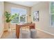 Bright home office featuring large window, stylish desk and decor, and comfortable seating at 2605 Gray Wolf Loop, Broomfield, CO 80023