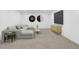 Spacious basement features contemporary decor, including modern wall art and neutral-toned furniture at 2011 S Gray Dr, Lakewood, CO 80227