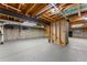 Unfinished basement with exposed ceiling, concrete walls, and concrete floors offer possibility at 2011 S Gray Dr, Lakewood, CO 80227