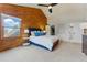 Bright and airy bedroom featuring a comfortable bed, wood accents, and large windows with natural light at 2011 S Gray Dr, Lakewood, CO 80227