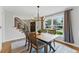 Cozy dining room featuring a wooden table with staircase view and plenty of natural light at 2011 S Gray Dr, Lakewood, CO 80227