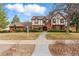Charming two-story home with brick and Tudor accents, plus a well-manicured lawn at 2011 S Gray Dr, Lakewood, CO 80227