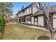 The rear exterior shows spacious yard, an exterior dining set and a light-filled interior at 2011 S Gray Dr, Lakewood, CO 80227