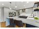 Modern kitchen features sleek white countertops, stainless steel appliances, and bar seating at 2011 S Gray Dr, Lakewood, CO 80227