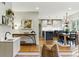 Open-concept living space with hardwood floors, stylish bar, and modern kitchen at 2011 S Gray Dr, Lakewood, CO 80227