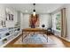 Bright home office featuring hardwood floors, built-in shelving, and a large window with natural light at 2011 S Gray Dr, Lakewood, CO 80227
