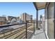 This balcony has black railings and a great view of the city at 1462 Yates St, Denver, CO 80204