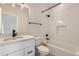 Updated bathroom featuring black hardware and fixtures with stylish tile flooring at 1462 Yates St, Denver, CO 80204