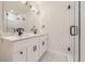 Modern bathroom features dual sinks, sleek hardware, and white tile shower for a contemporary look at 1462 Yates St, Denver, CO 80204