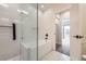 Bright bathroom with a soaking tub and white subway tile, complete with glass shower doors at 1462 Yates St, Denver, CO 80204