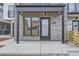 Townhouse entryway with stone facade and modern door at 1462 Yates St, Denver, CO 80204