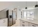 Open-concept kitchen with a large refrigerator, an island and plenty of natural light at 1462 Yates St, Denver, CO 80204