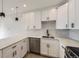 Modern kitchen with stainless steel appliances, white cabinets, and stylish countertops at 1462 Yates St, Denver, CO 80204
